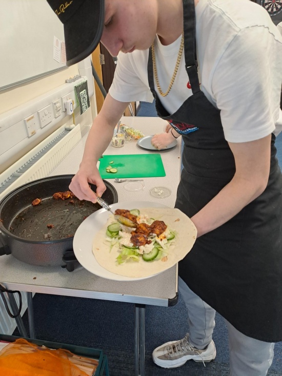 community chef and young people- jerk chicken wraps 